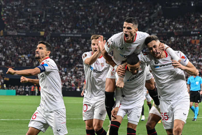 Players from Sevilla pictured celebrating a goal against Roma in the 2023 UEFA Europa League final